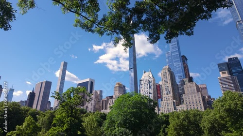 Summer morning in Central Park with view of Billionaires' Row supertall skyscrapers. Midtown Manhattan, New York City