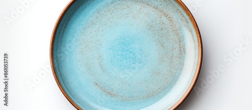 Aerial view of an empty circular ceramic baking dish against a white background, with copy space image available.