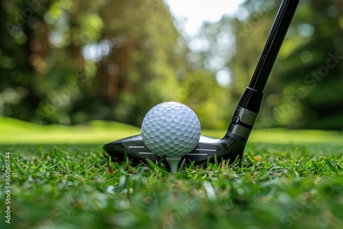 Golf Club and Ball on Lush Green Grass