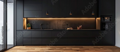 Panel kuchenny z motywem Modern kitchen with black furniture and wooden floor. Copy space image. Place for adding text or design