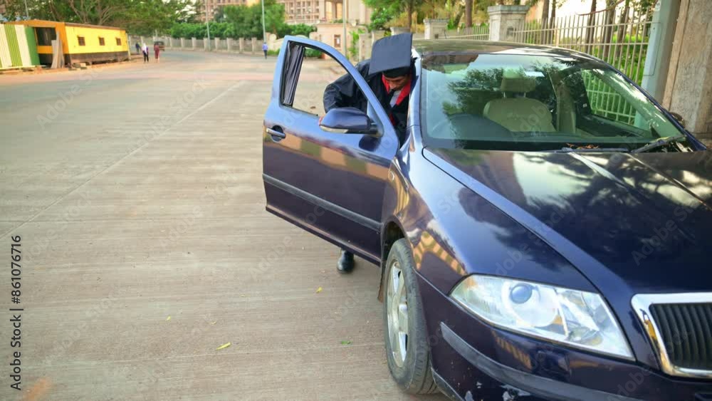 Graduate get out from car on street