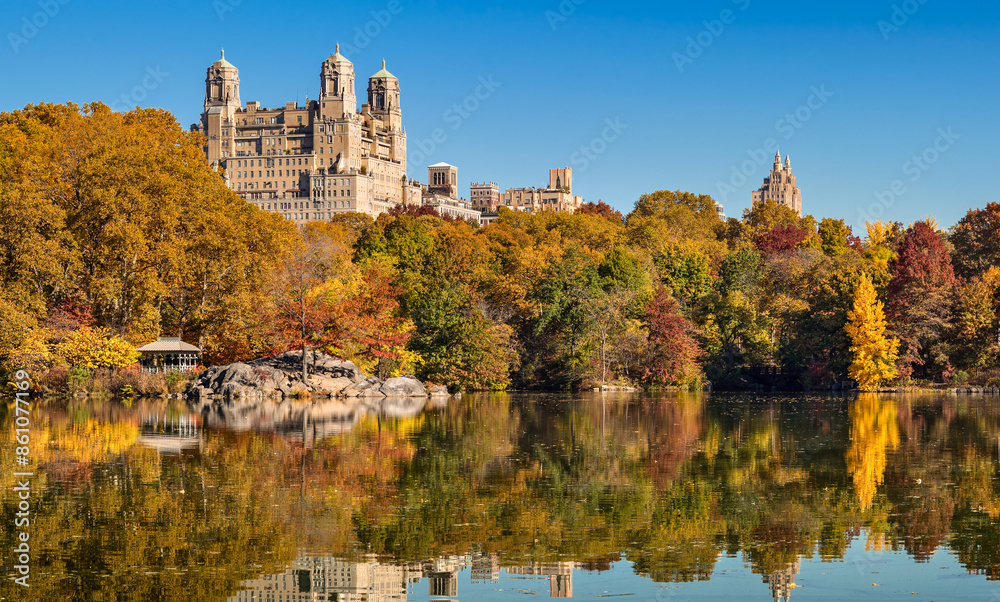 Scenic autumn view of the Central Park lake with colorful fall foliage. Upper West Side Historic District, Manhattan. New York City Scenic autumn view of the Central Park lake with colorful fall foliage. Upper West Side Historic District, Manhattan. New York City