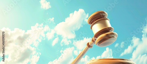 Judges wooden gavel, and bluse sky pastel background. Copy space image. Place for adding text and design photo