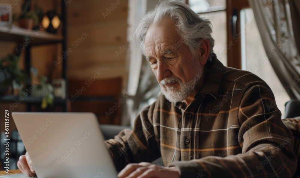An elderly person enjoys using a laptop or tablet at home, reflecting active senior lifestyle and technology adoption An elderly person enjoys using a laptop or tablet at home, reflecting active senior lifestyle and technology adoption