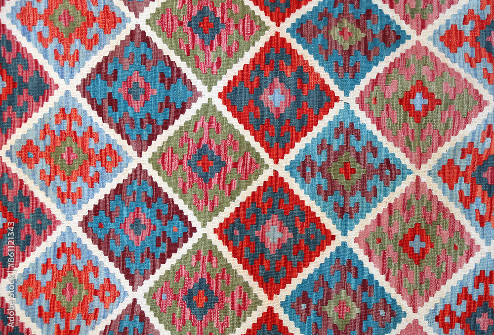 Texture of iranian traditional handmade wool carpet with geometric pattern Texture of iranian traditional handmade wool carpet with geometric pattern