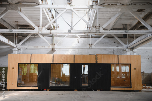 Newly built single storey prefabricated modular building. Prefabricated mobile wooden house at construction site