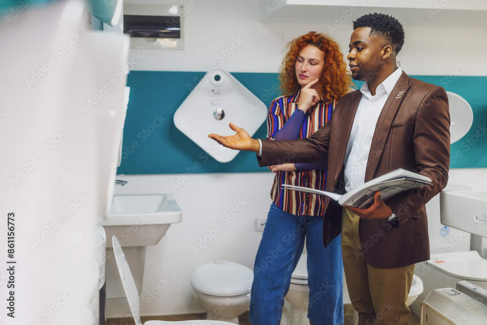 Fototapeta premium Salesman is talking with a customer who is choosing the goods.