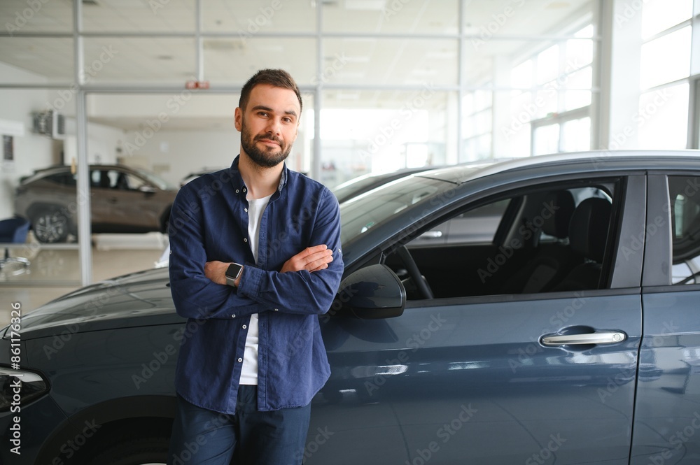Man customer male buyer client chooses auto wants to buy new automobile Man customer male buyer client chooses auto wants to buy new automobile