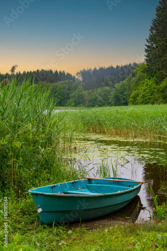 Boat on the shore of the lake, Belarus photo