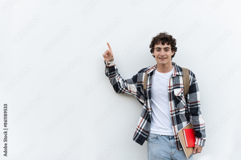 Teenager student pointing aside with fingers hand gesture at white copy space background advertising promo product Teenager student pointing aside with fingers hand gesture at white copy space background advertising promo product
