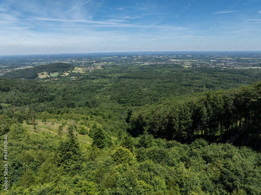 Fototapeta premium Summer green forest in Jaworze. Drone view in Beskid mountains. Beskid mountains in Jaworze. Drone fly above green mountains in summer. Polish green mountains and hills aerial drone video