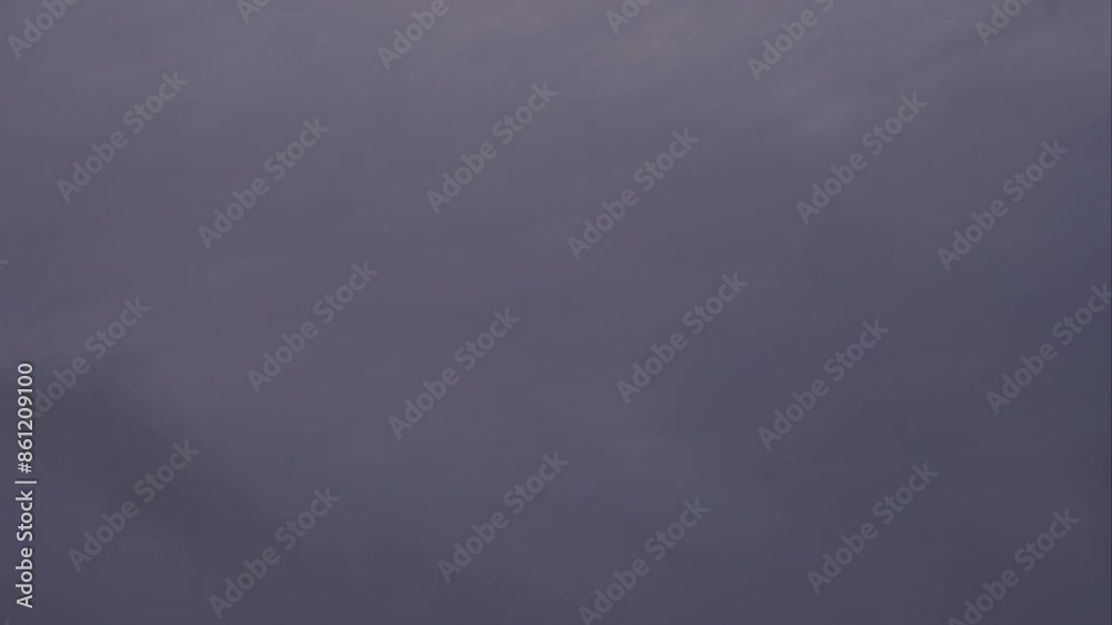 Timelapse of fast moving dark storm clouds in sky cover sun, Latvia Timelapse of fast moving dark storm clouds in sky cover sun, Latvia