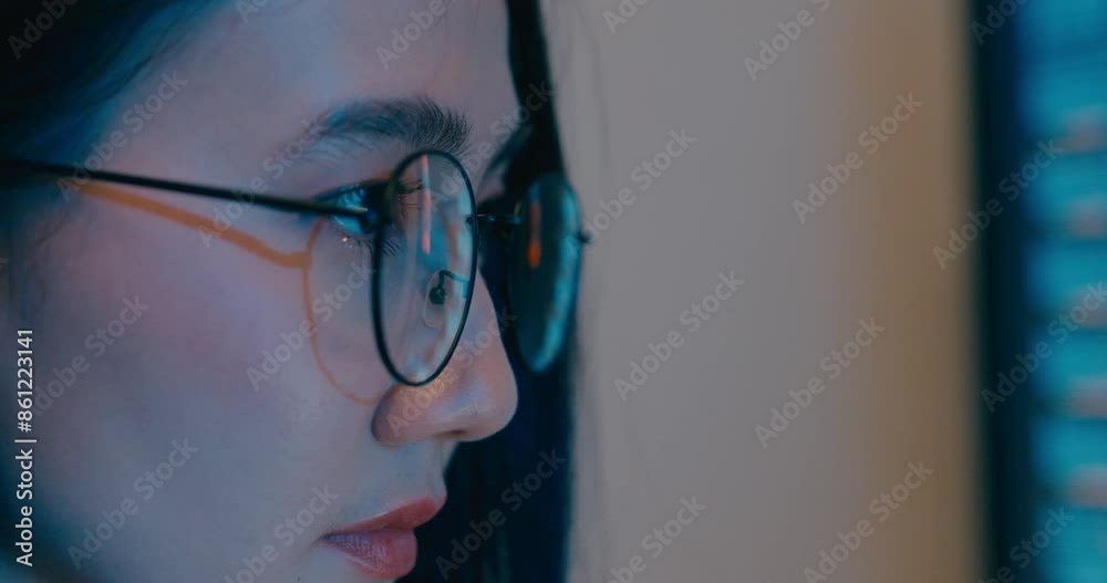 Closeup young Asia female freelance eyeglasses typing write prompt AI bot IT program nomad, video game, terminal with coding language, designer, big data center on desktop computer in night office.
