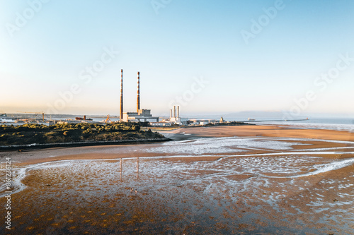 Aerial View of Poolbeg Chimneys in Dublin with Expansive Coastal Landscape and Industrial Background photo
