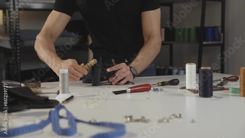 Wallpaper Mural A shoemaker in the process of repairing shoes Torontodigital.ca