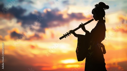 A silhouette of a young lady in an ancient Chinese dress playing a pipa against a beautifully detailed sunset background