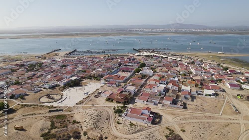 Panoramic orbit above Culatra Island Olhao Portugal with view of boats and harbor port