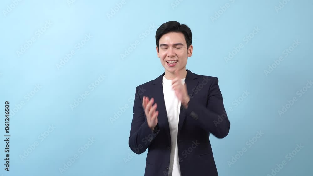 Young Asian businessman on blue background Young Asian businessman on blue background
