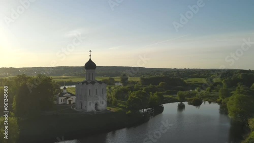 drone flight at dawn around the Orthodox Church of the Intercession of the Blessed Virgin Mary on the Nerl River, Bogolyubovo, Suzdal district, Vladimir region, Russia. High-quality 4k footage