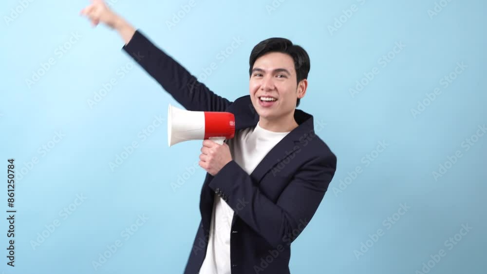 Young Asian businessman on blue background Young Asian businessman on blue background