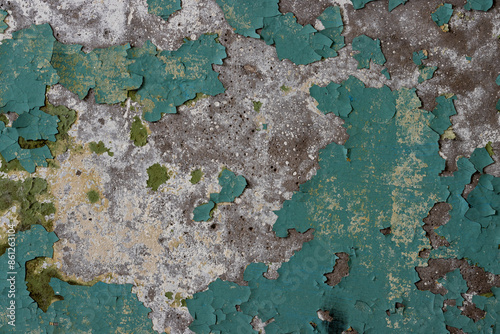 Peeling paint on the wall. Old concrete wall with cracked flaking paint. Weathered rough painted surface with patterns of cracks and peeling. Grunge texture for background and design. High resolution. © Andrei Stepanov