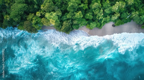 Aerial view of blue ocean waves along the beautiful natural beach of the Andaman Sea. Southern Thailand