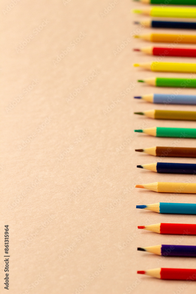 Bright school supplies on plain background. Assortment of colorful stationery, pencil, set of colored pencils . Back to school concept, artist concept Bright school supplies on plain background. Assortment of colorful stationery, pencil, set of colored pencils . Back to school concept, artist concept