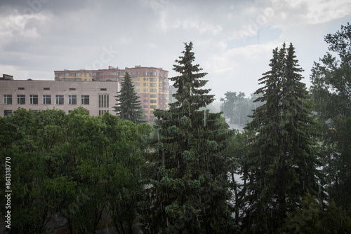 View from the window to the street during a downpour. Ukraine
