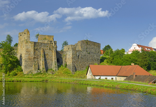 Borotin Castle ruins with romantic pond in the foreground, Borotin, South Bohemia, Czech Republic. photo