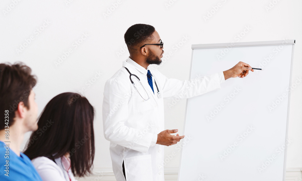 Weekly Meeting. Team Of Doctors Having Brainstorming Session In Conference Room Weekly Meeting. Team Of Doctors Having Brainstorming Session In Conference Room