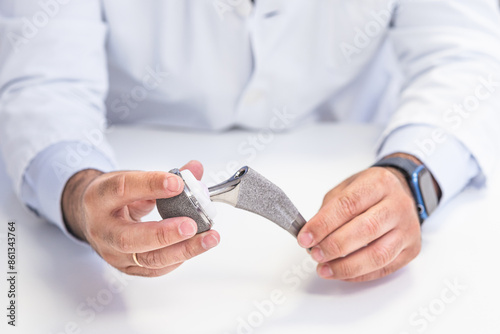 Orthopedic Surgeon Demonstrating Hip Prosthesis photo
