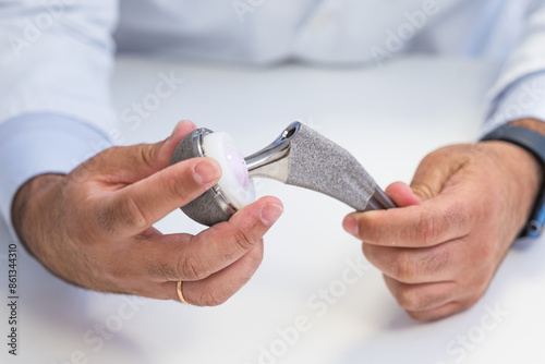 Orthopedic Surgeon Demonstrating Hip Prosthesis