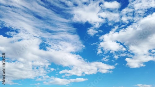 Movement of the clouds in the blue sky. Timelapse