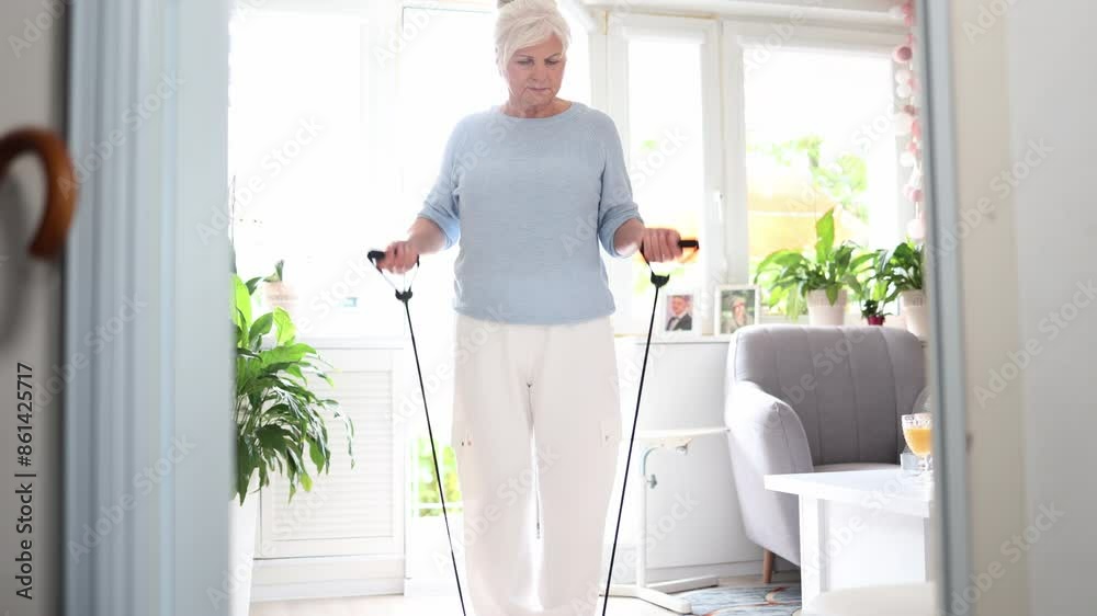 Active senior woman training at home
Active senior woman training at home