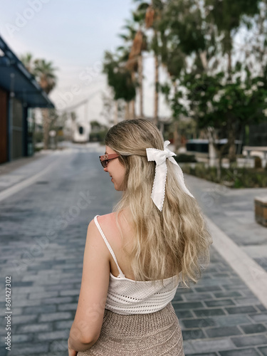 Beautiful blonde girl on the atmospheric La Mer beach in Dubai, 2024