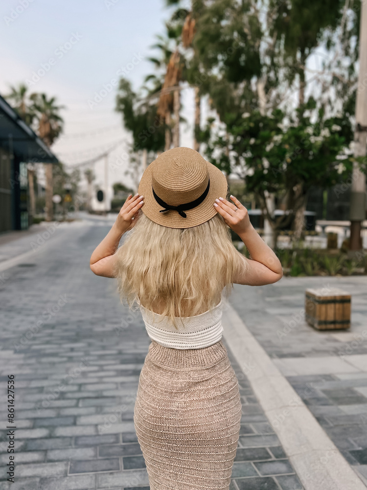Beautiful blonde girl on the atmospheric La Mer beach in Dubai, 2024