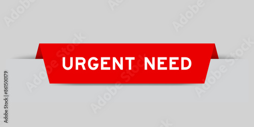 Red color inserted label with word urgent need on gray background