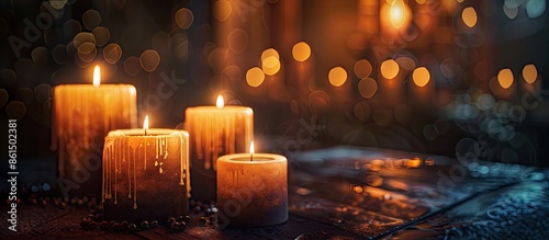 A dark temple setting showcasing contemporary electronic candles resembling traditional wax ones, with a blurred background and ample room for text in the image.