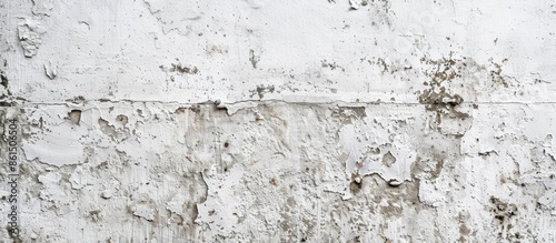 A vintage or grungy white background resembling natural cement or stone with an old texture, suitable as a retro pattern wall with copy space image.
