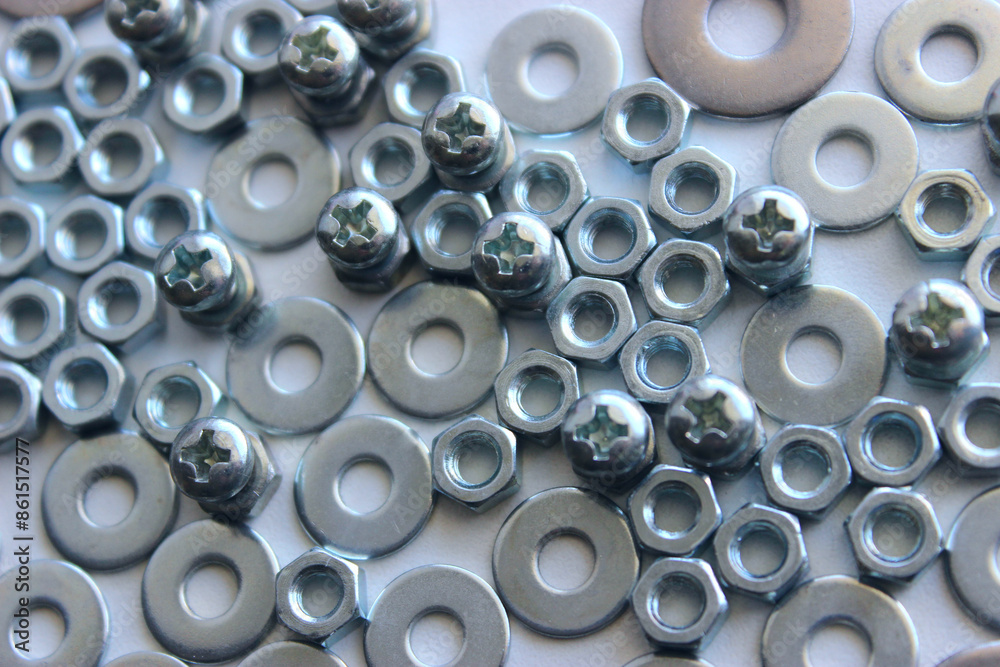 Steel color cross head bolts inserted in hex nuts between flat washers. Detailed stock photo for screw and fastener products illustration Steel color cross head bolts inserted in hex nuts between flat washers. Detailed stock photo for screw and fastener products illustration