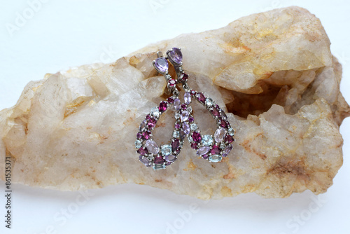 Beautiful silver earrings with natural semi-precious stones: garnets - rhodolites, amethysts and topazes. photo