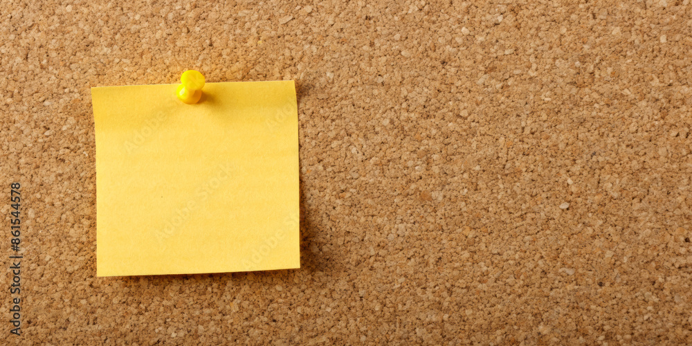 Yellow sticky note pinned on a cork board, close-up showing the texture of the board and the bright yellow color of the note, ideal for reminders or messages. Yellow sticky note pinned on a cork board, close-up showing the texture of the board and the bright yellow color of the note, ideal for reminders or messages.