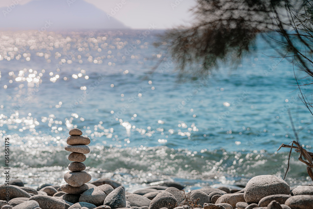 Stones balance on beach, sunset shot with blurry background Stones balance on beach, sunset shot with blurry background