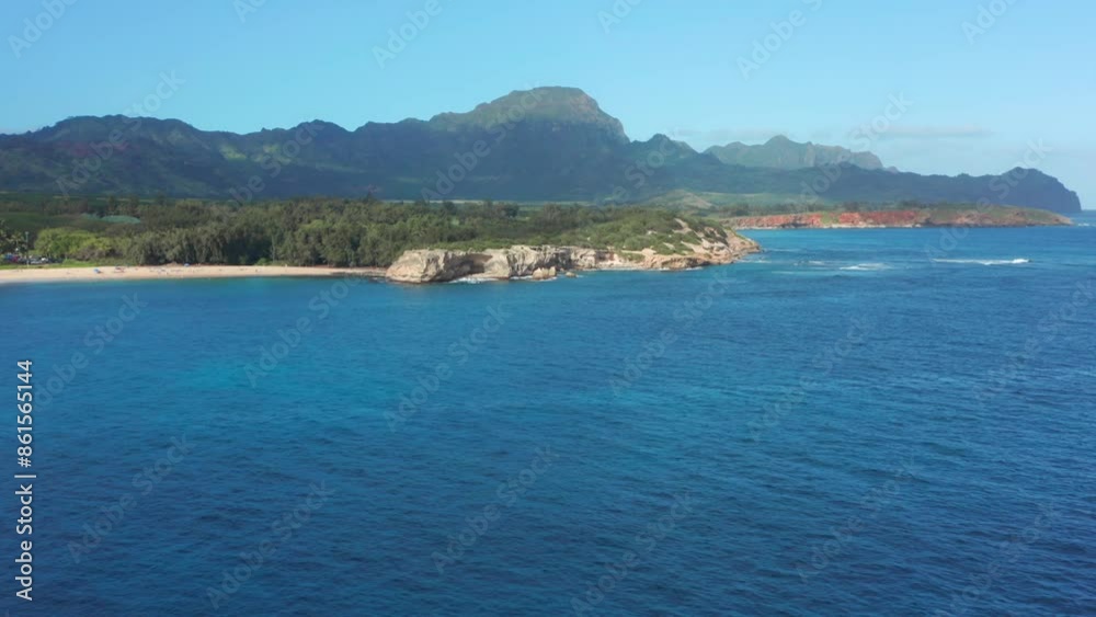 Beautiful tropical island of Hawaii on sunny day. view over blue ocean above of islands coastline with mountains and nature Beautiful tropical island of Hawaii on sunny day. view over blue ocean above of islands coastline with mountains and nature