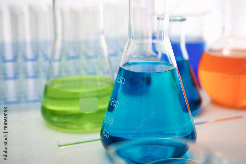 Laboratory glassware placed in a table with liquid sample Laboratory glassware placed in a table with liquid sample