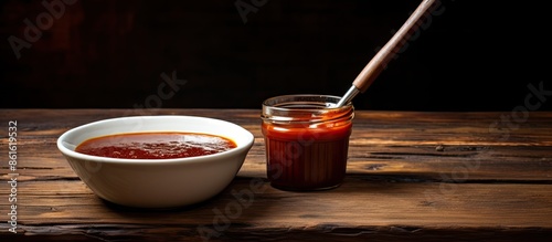 A saucer with barbecue sauc...