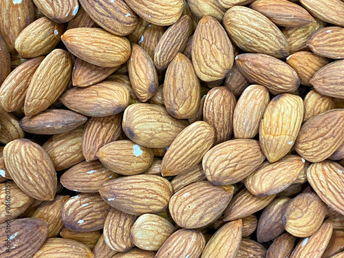 Almonds. Raw fresh organic almond nuts. Almond background.  photo