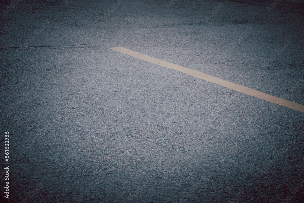 Fototapeta premium A road with a white line down the middle