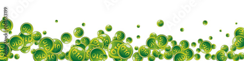 Vitamin Q10 round capsules scattered randomly.