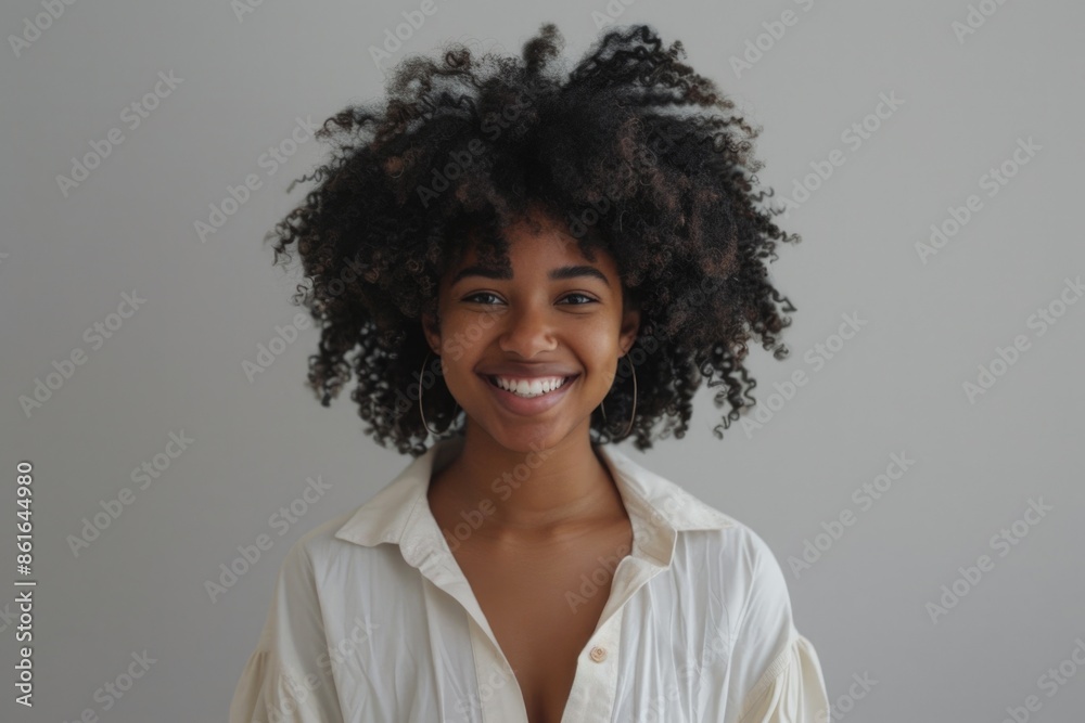A woman with curly hair is wearing a white shirt, perfect for a casual everyday scene or a relaxed outdoor setting A woman with curly hair is wearing a white shirt, perfect for a casual everyday scene or a relaxed outdoor setting